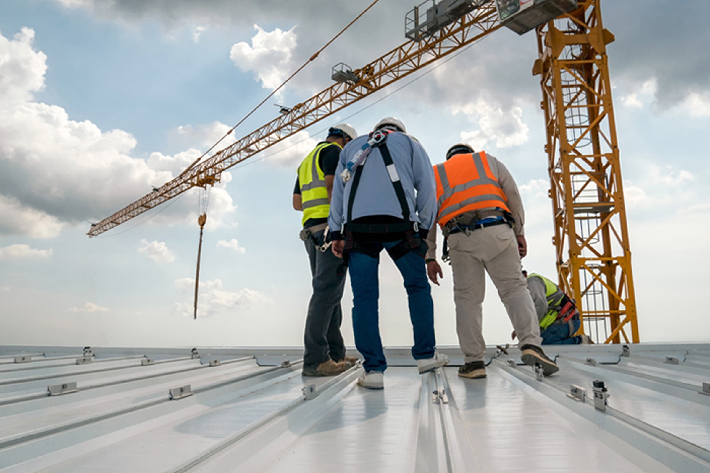 Commercial roof contractor crew working on a metal roof in Lake Charles, LA