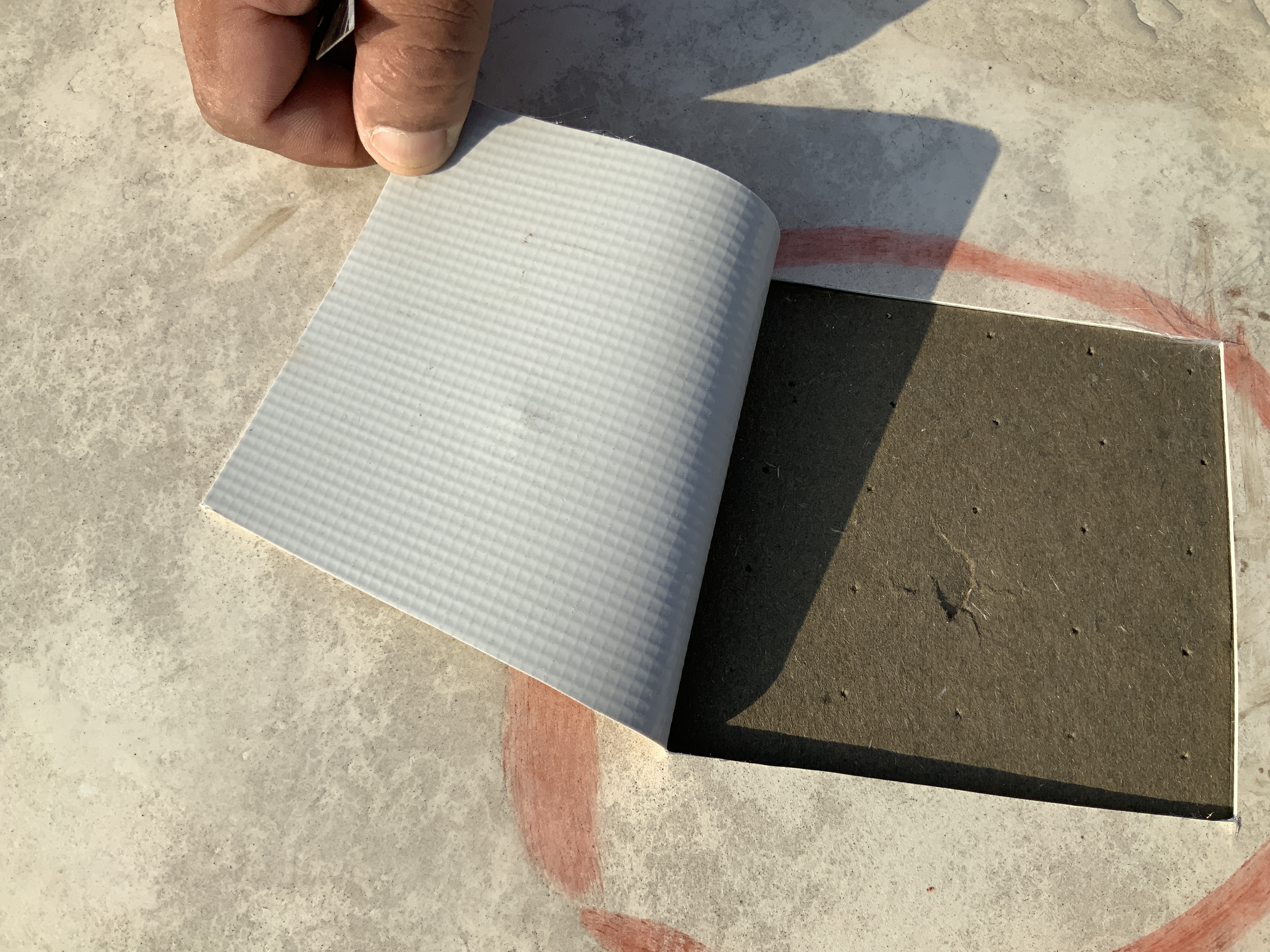 signs of hail damage on a flat roof